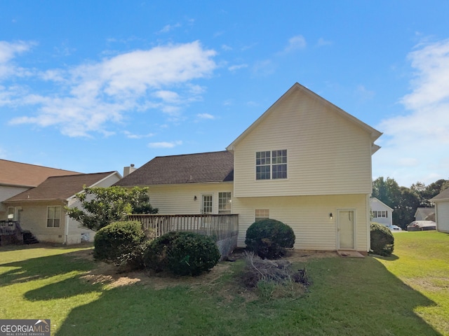 exterior space with a yard and a wooden deck