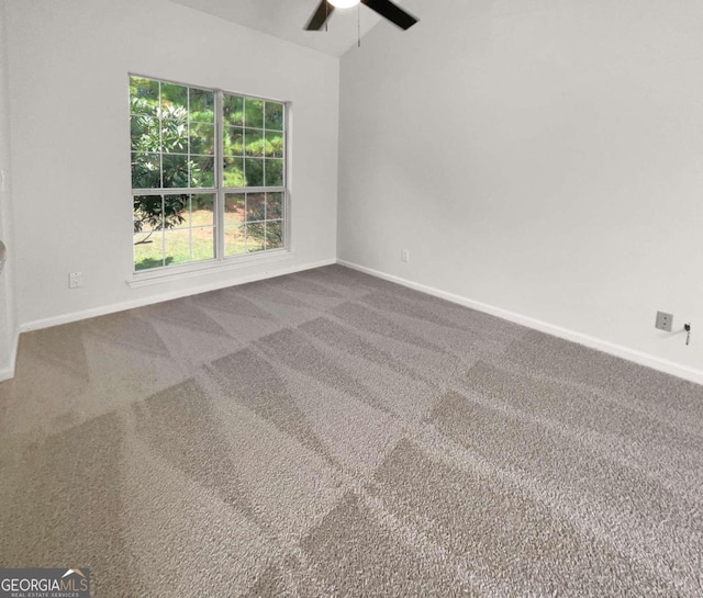 empty room featuring ceiling fan and carpet floors