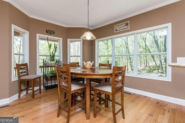 dining area featuring plenty of natural light and light hardwood / wood-style floors