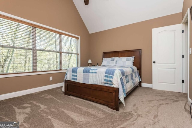 carpeted bedroom with vaulted ceiling