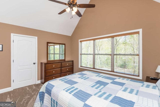 carpeted bedroom with vaulted ceiling and ceiling fan