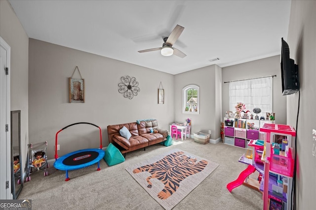 rec room with ceiling fan and carpet flooring