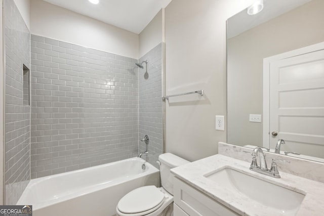 bathroom with shower / bathtub combination, toilet, and vanity