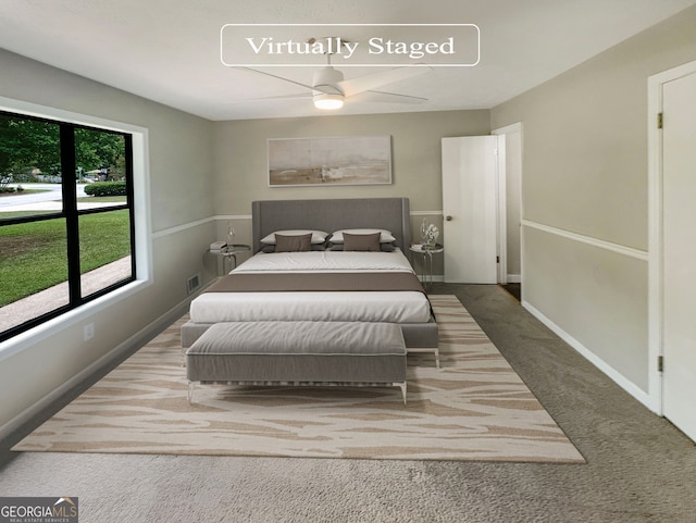 carpeted bedroom featuring ceiling fan