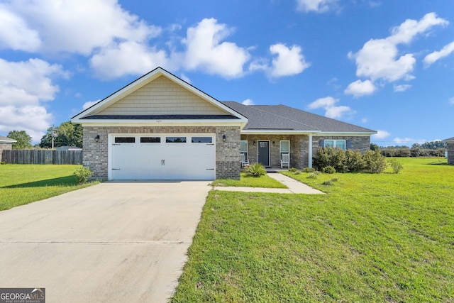 view of front of home featuring a garage and a front lawn