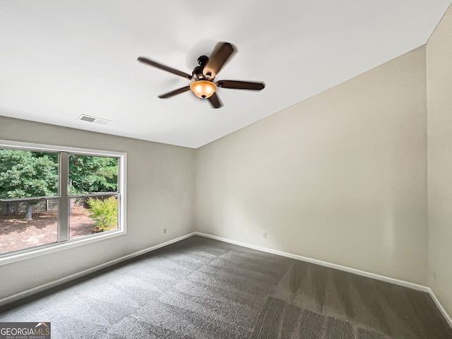 carpeted spare room with ceiling fan