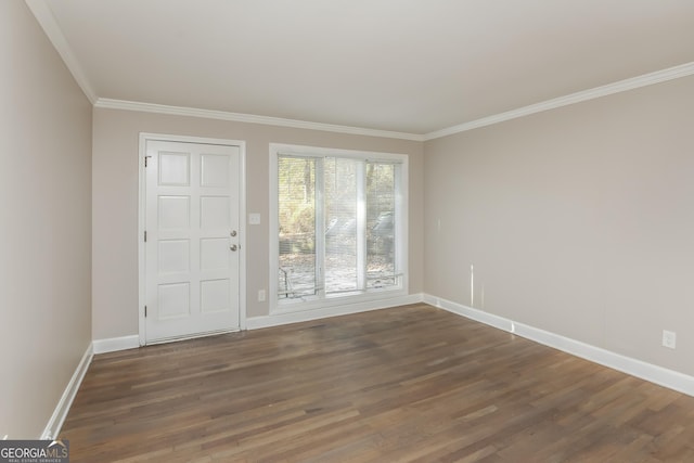 unfurnished room with dark hardwood / wood-style flooring and crown molding