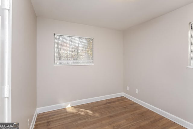 empty room featuring dark wood-type flooring