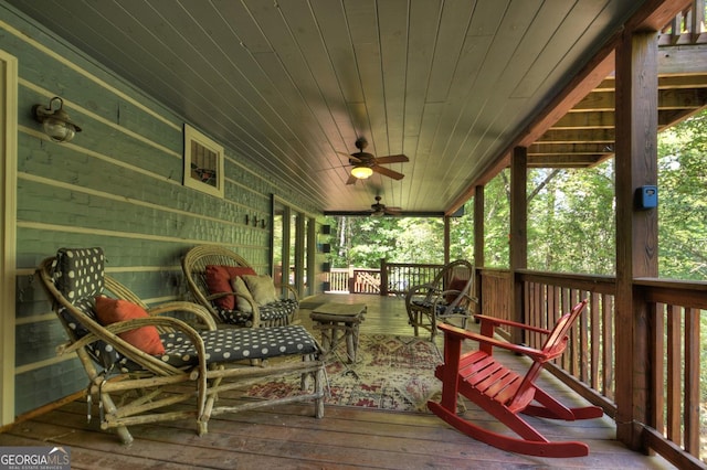 sunroom / solarium featuring wooden ceiling and ceiling fan