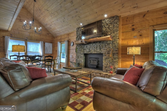 living room with high vaulted ceiling, a fireplace, wooden ceiling, hardwood / wood-style floors, and a chandelier