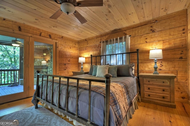 bedroom featuring wooden ceiling, wood-type flooring, and access to outside