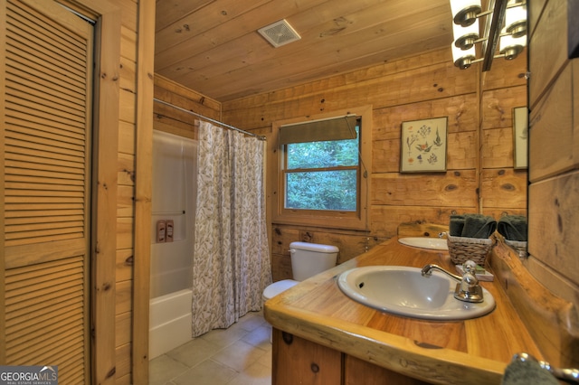 full bathroom featuring vanity, wooden walls, toilet, and wooden ceiling