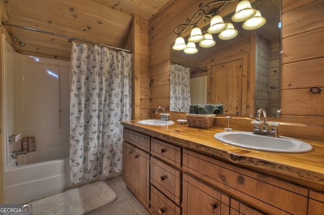 bathroom featuring vanity, wooden walls, wooden ceiling, tile patterned floors, and shower / tub combo with curtain