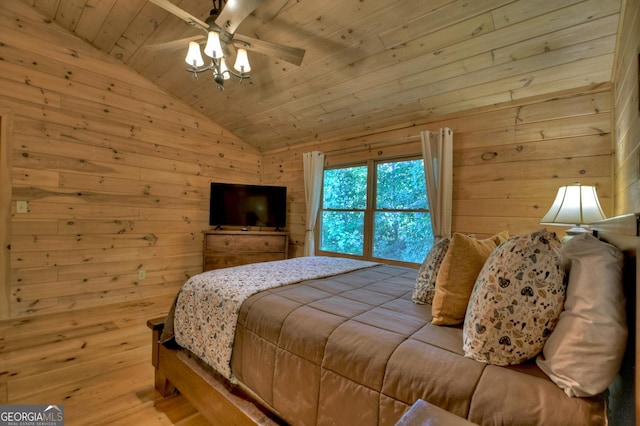 bedroom with lofted ceiling, wood ceiling, wooden walls, and a ceiling fan