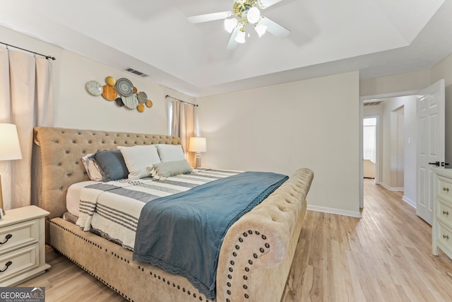 bedroom featuring ceiling fan and light hardwood / wood-style floors