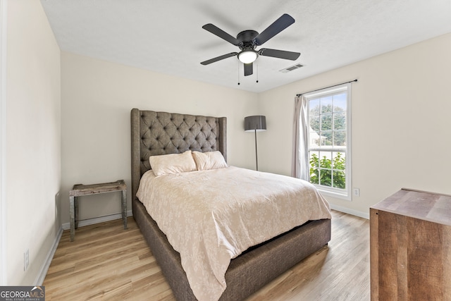 bedroom featuring light wood-type flooring and ceiling fan