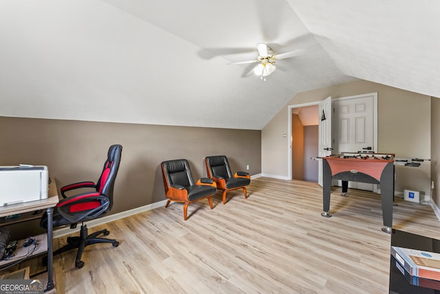 home office featuring vaulted ceiling, light wood-type flooring, and ceiling fan