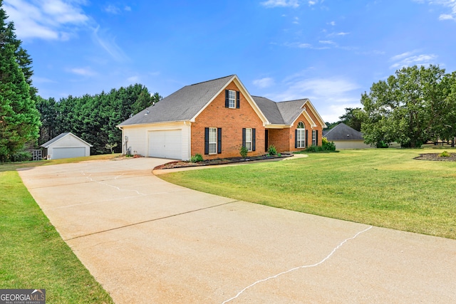 view of front of property with a front yard and a garage