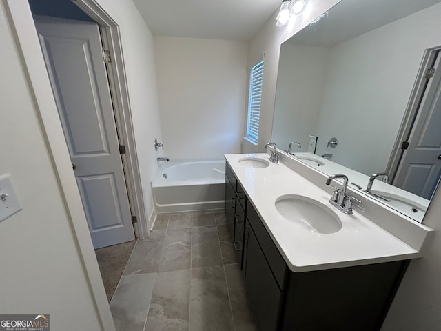 bathroom with vanity and a washtub