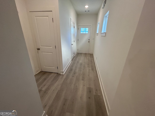 hallway with light wood-type flooring