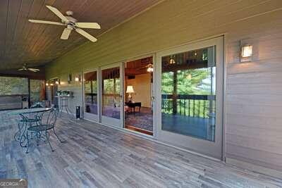 wooden terrace with ceiling fan