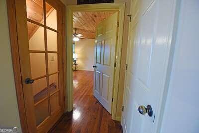 hallway featuring hardwood / wood-style flooring