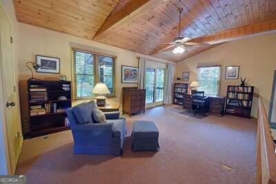 interior space featuring wood ceiling, ceiling fan, and lofted ceiling