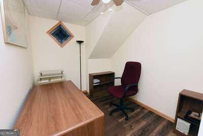 office area featuring ceiling fan and dark hardwood / wood-style floors