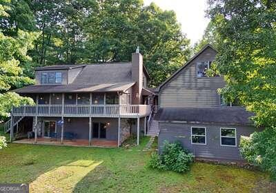 rear view of house with a yard