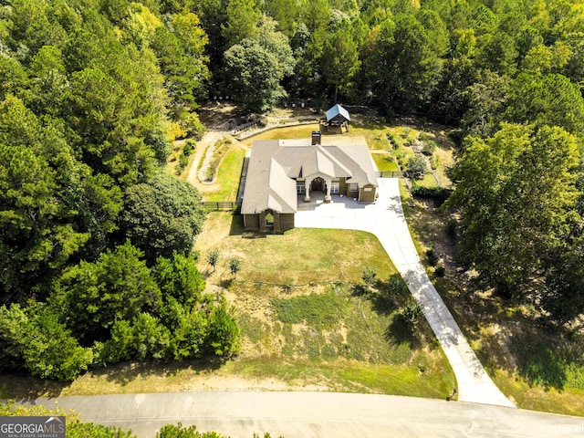 ranch-style home featuring a garage and a front lawn