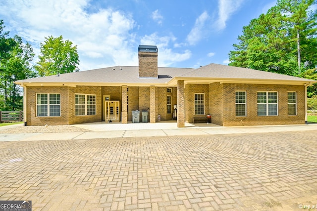 rear view of property with a patio area