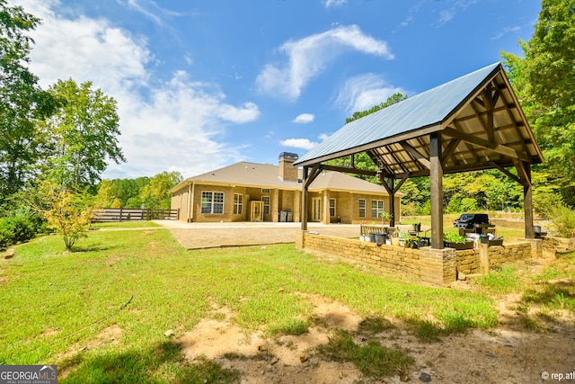 rear view of house featuring a patio area