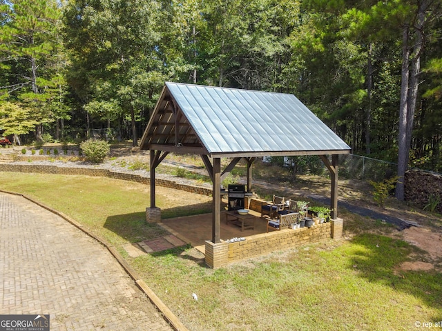 view of community featuring a gazebo and a yard