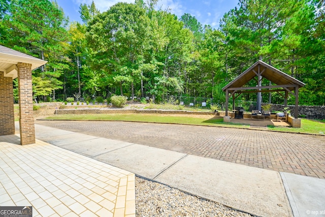 exterior space featuring a gazebo and a patio