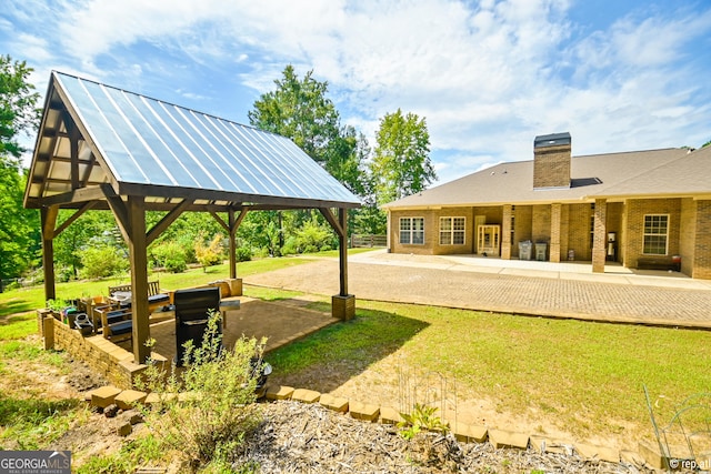 exterior space with a gazebo and a patio