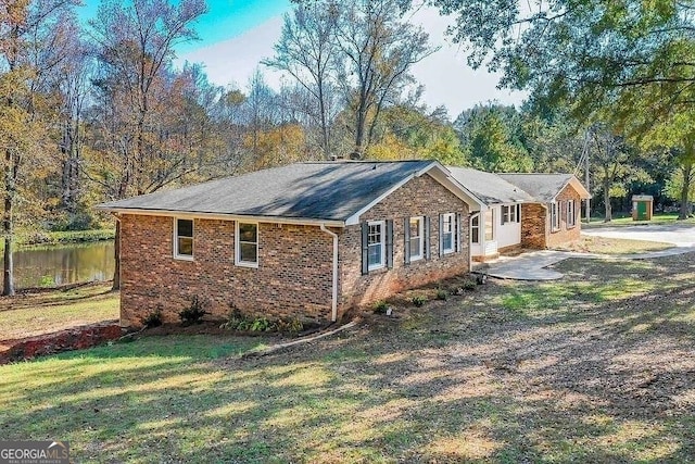 view of home's exterior featuring a yard