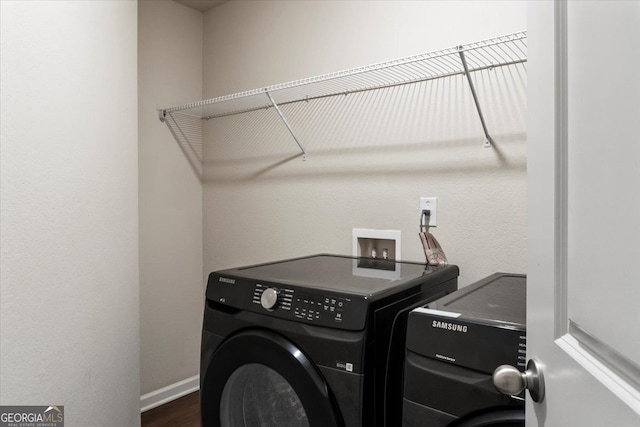 washroom featuring washing machine and clothes dryer