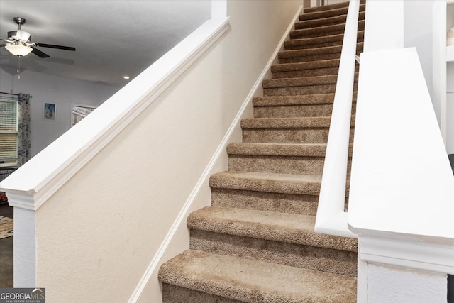 stairs with ceiling fan