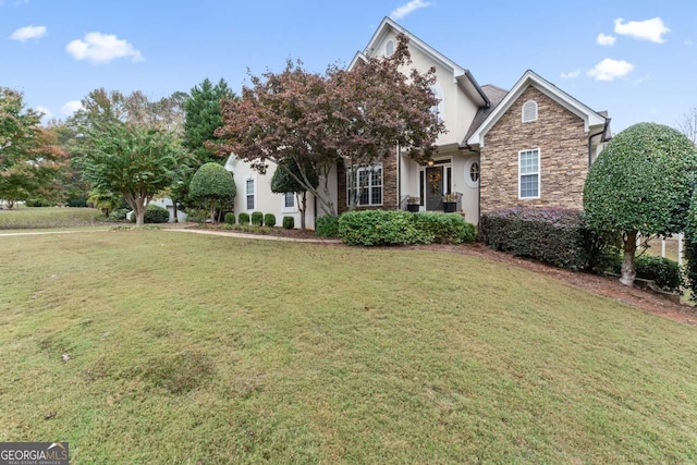 obstructed view of property featuring a front yard