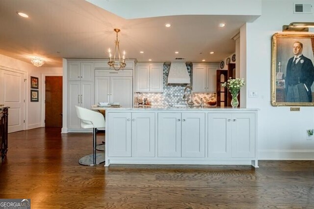 walk in closet featuring dark hardwood / wood-style floors