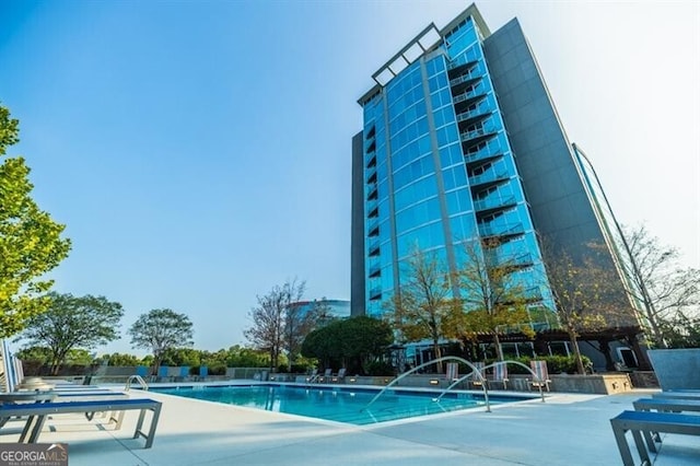 view of swimming pool featuring a patio area