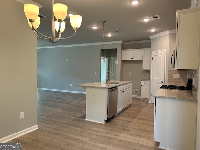 kitchen featuring sink, white cabinetry, a center island with sink, stainless steel dishwasher, and pendant lighting