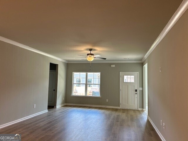 unfurnished room featuring ornamental molding, dark hardwood / wood-style floors, and ceiling fan