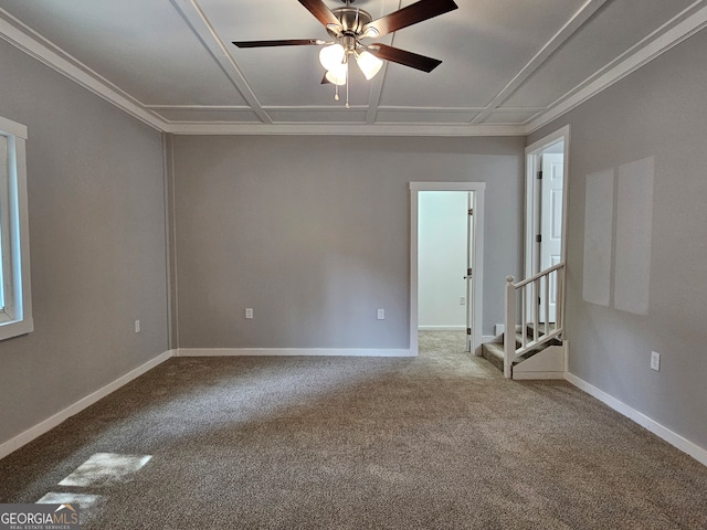 carpeted spare room featuring ceiling fan and ornamental molding