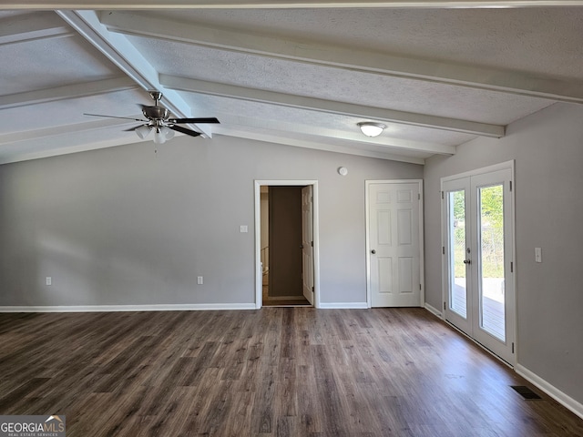 spare room featuring ceiling fan, a textured ceiling, hardwood / wood-style flooring, vaulted ceiling with beams, and french doors