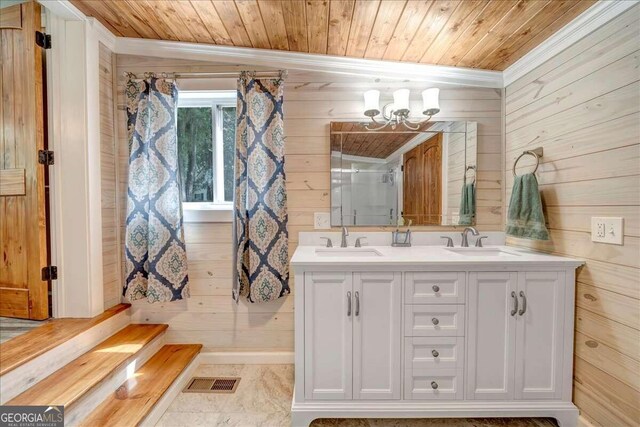 bathroom with wooden ceiling, vanity, and wood walls