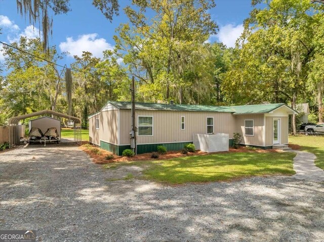 view of side of home featuring a carport