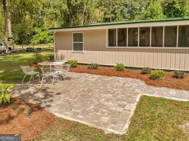 exterior space featuring a sunroom