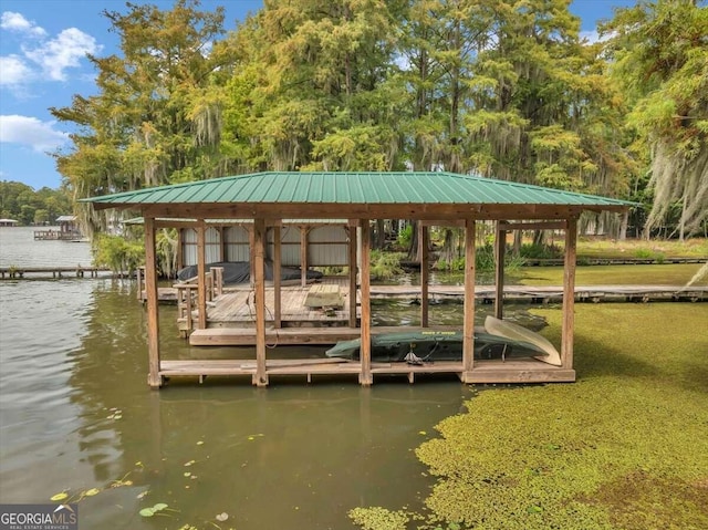 dock area featuring a water view