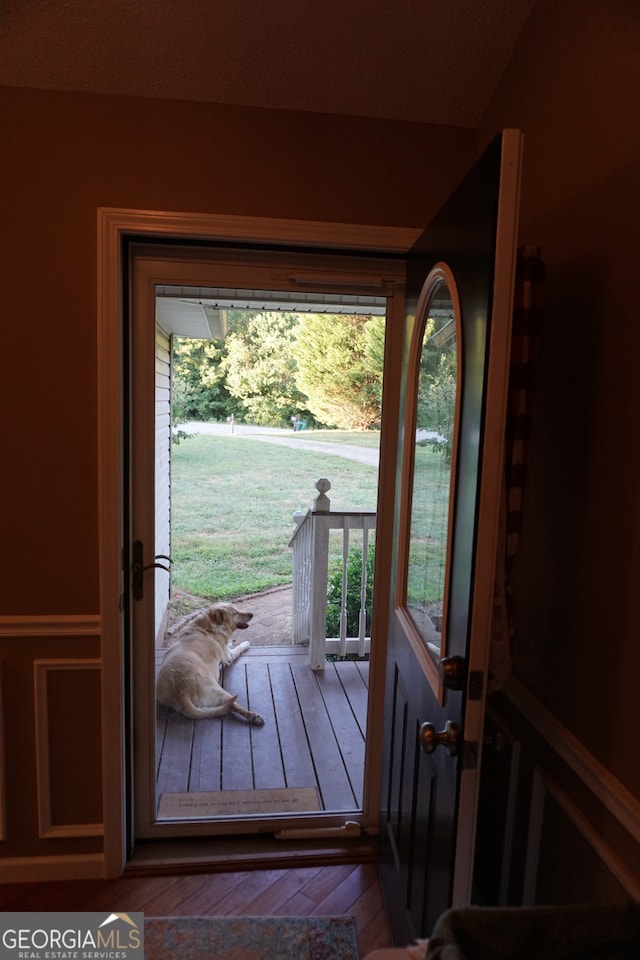 entryway with hardwood / wood-style floors